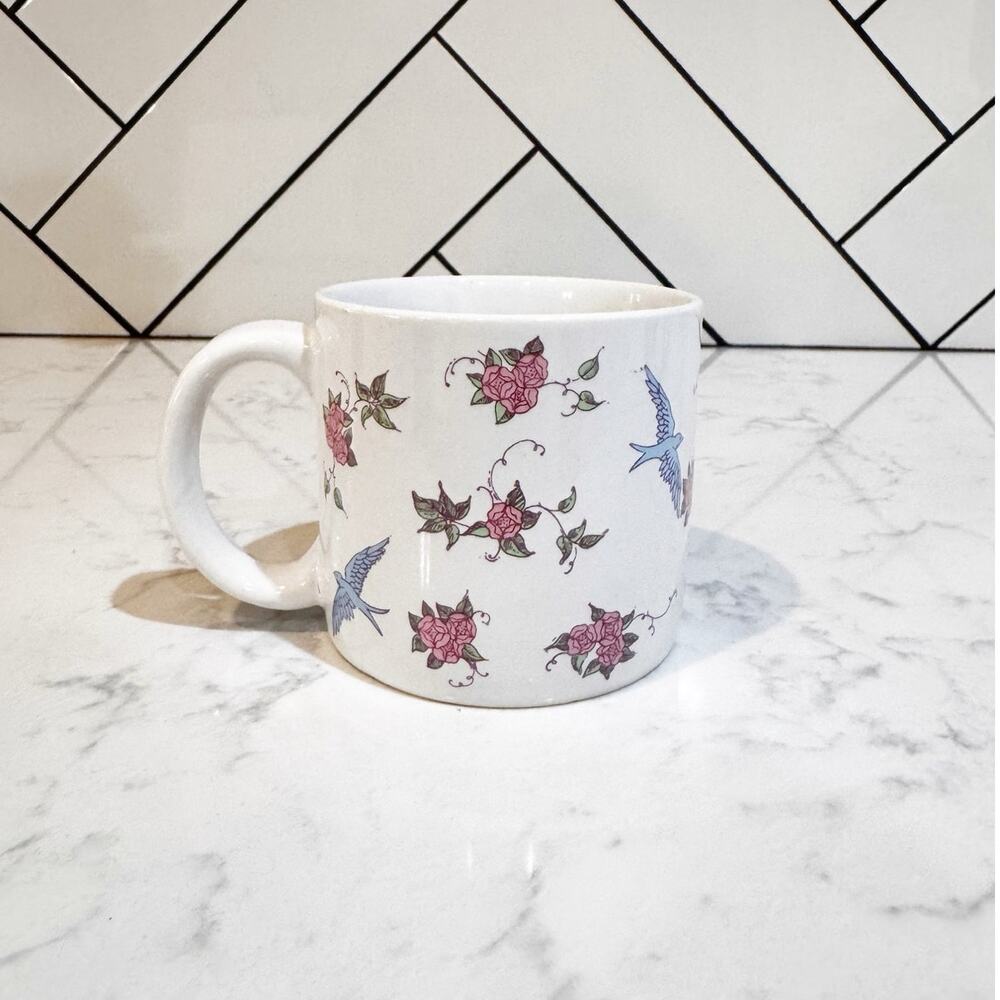 Inarco winding delicate pink rose vines interspersedsmall blue birds in flight